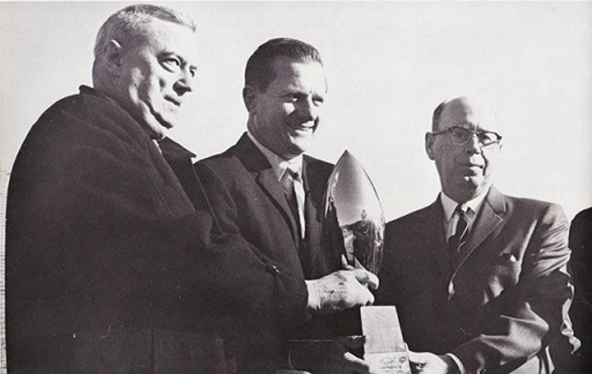 Frank Broyles with trophy